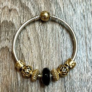 Stunning Pandora two-tone bangle with solid 18k gold charms